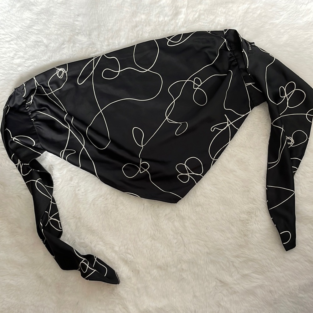 Silk blck lines pattern top, open back. Used once.